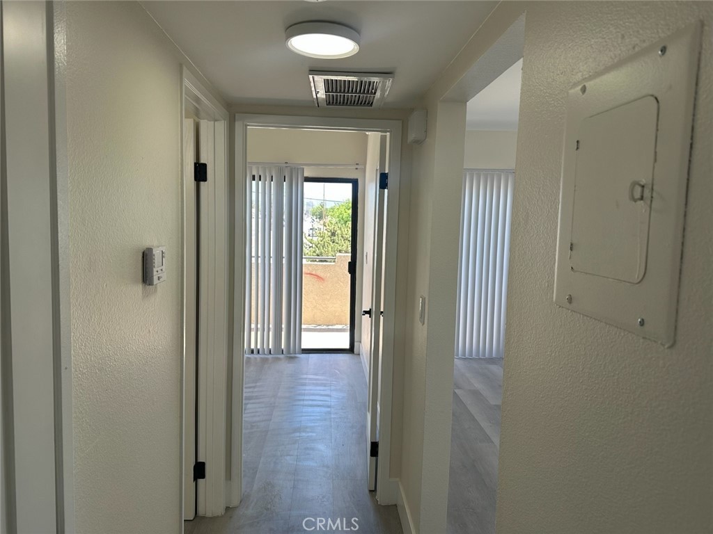 44155 10th Lancaster, CA 93534 - Photo 13 of 15 a view of a hallway with wooden floor and closet area