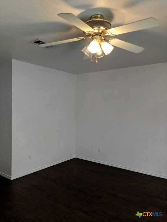 1114 Horizon Drive, Unit C Killeen, TX 76549 - Photo 2 of 5 en empty room with wooden floor and fan