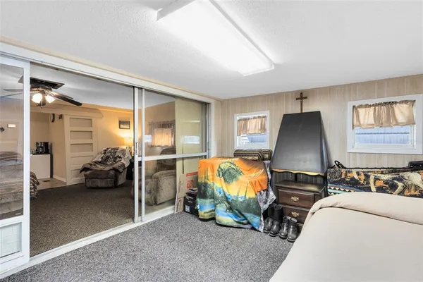 a bedroom with bed and a couch