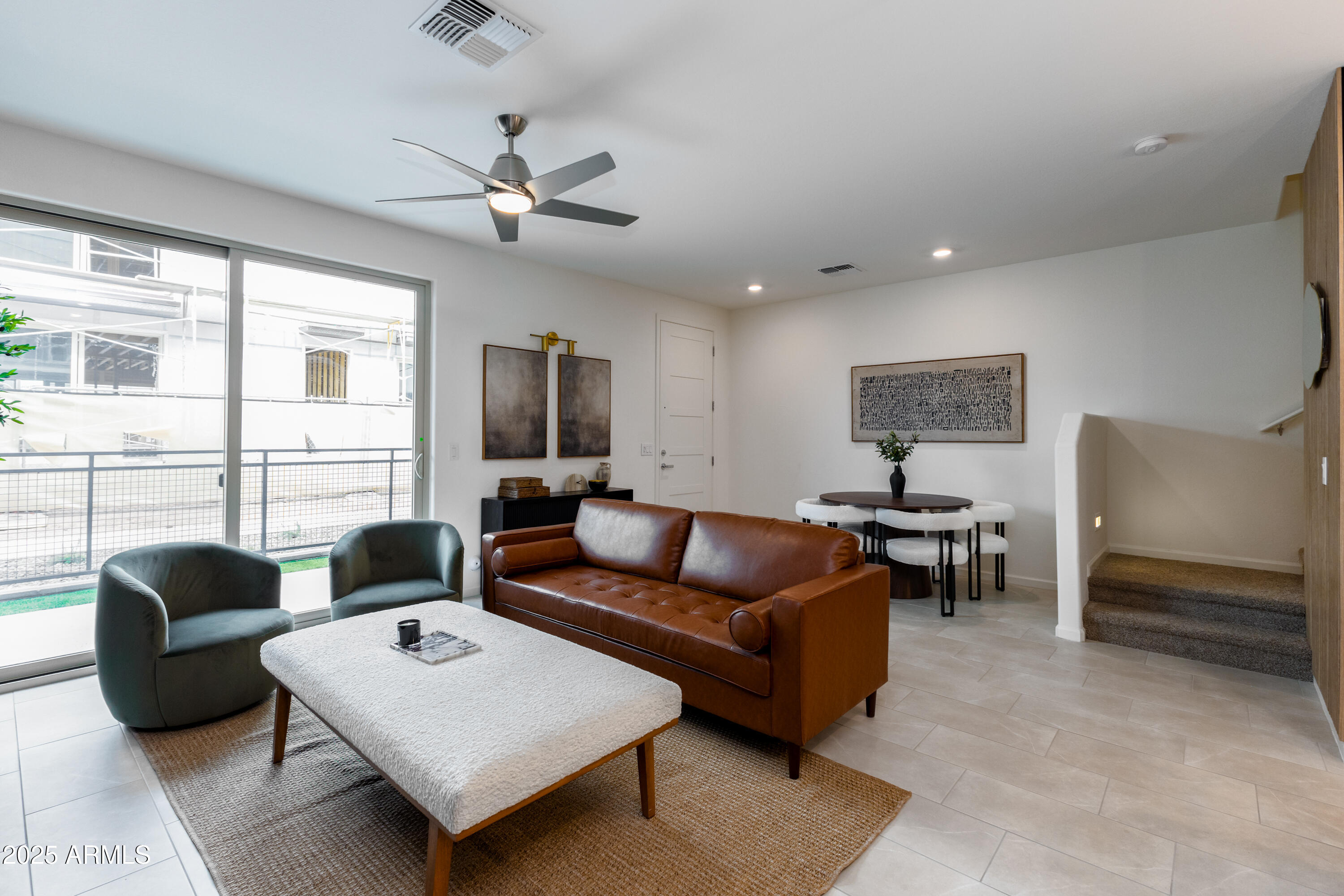 651 North Ironwood Drive, Unit 3 Apache Junction, AZ 85120 - Photo 16 of 48 a living room with furniture and a large window