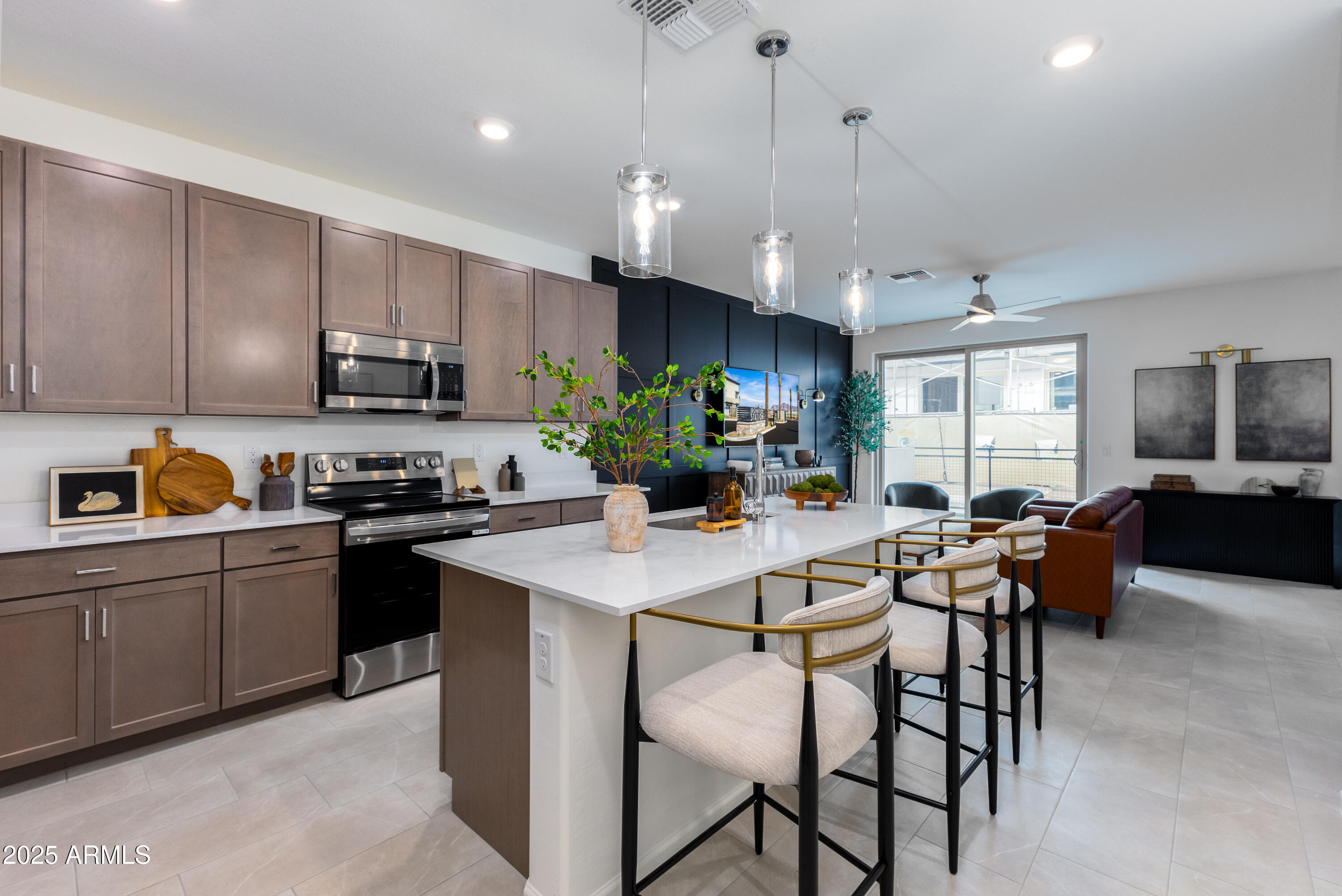 651 North Ironwood Drive, Unit 3 Apache Junction, AZ 85120 - Photo 19 of 48 a kitchen with a table chairs microwave and cabinets