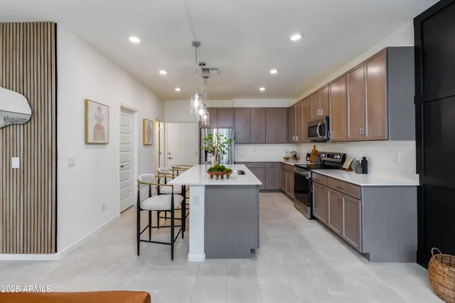 a kitchen with counter top space cabinets and stainless steel appliances