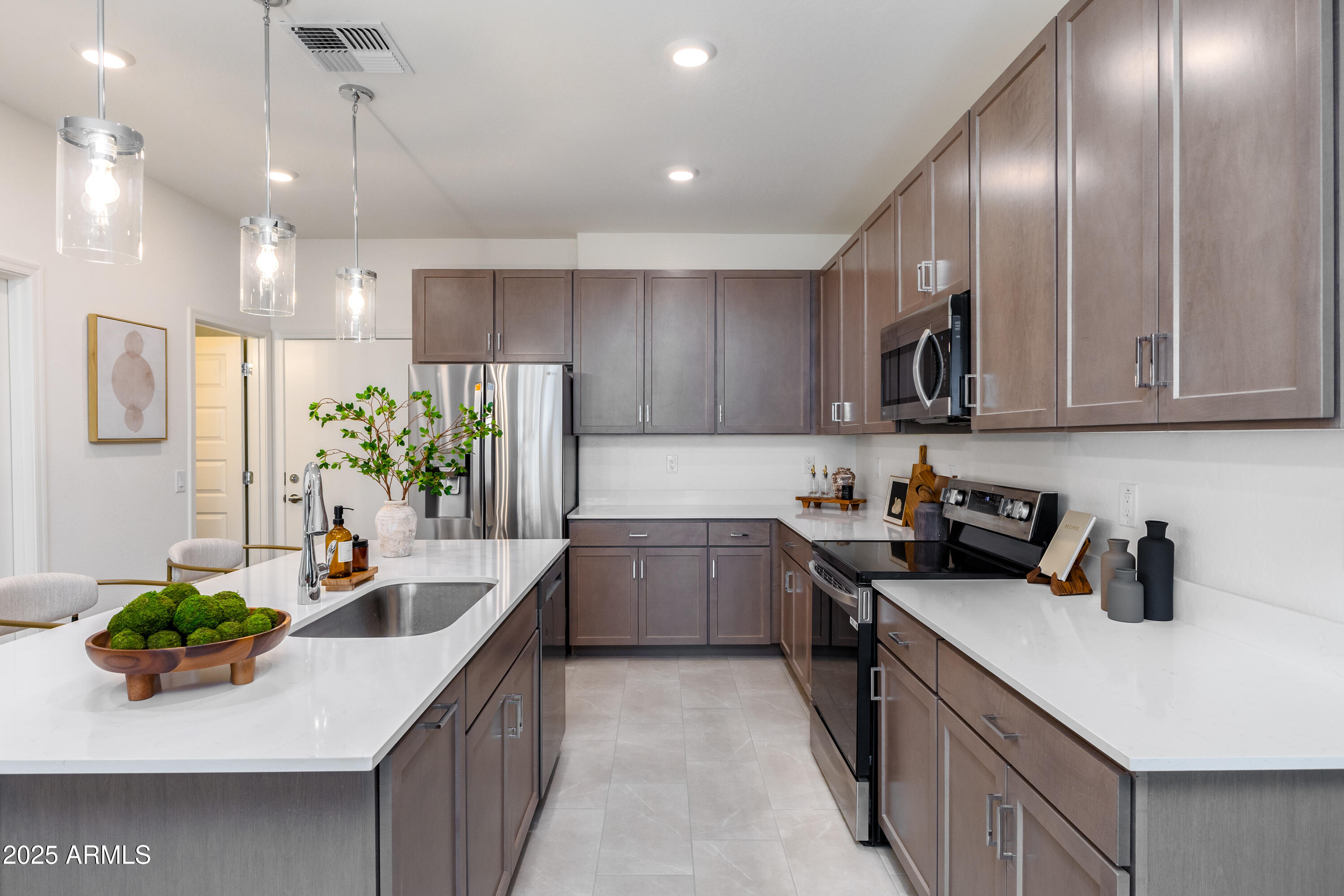 651 North Ironwood Drive, Unit 3 Apache Junction, AZ 85120 - Photo 22 of 48 a kitchen with kitchen island granite countertop a sink a counter top space appliances and cabinets