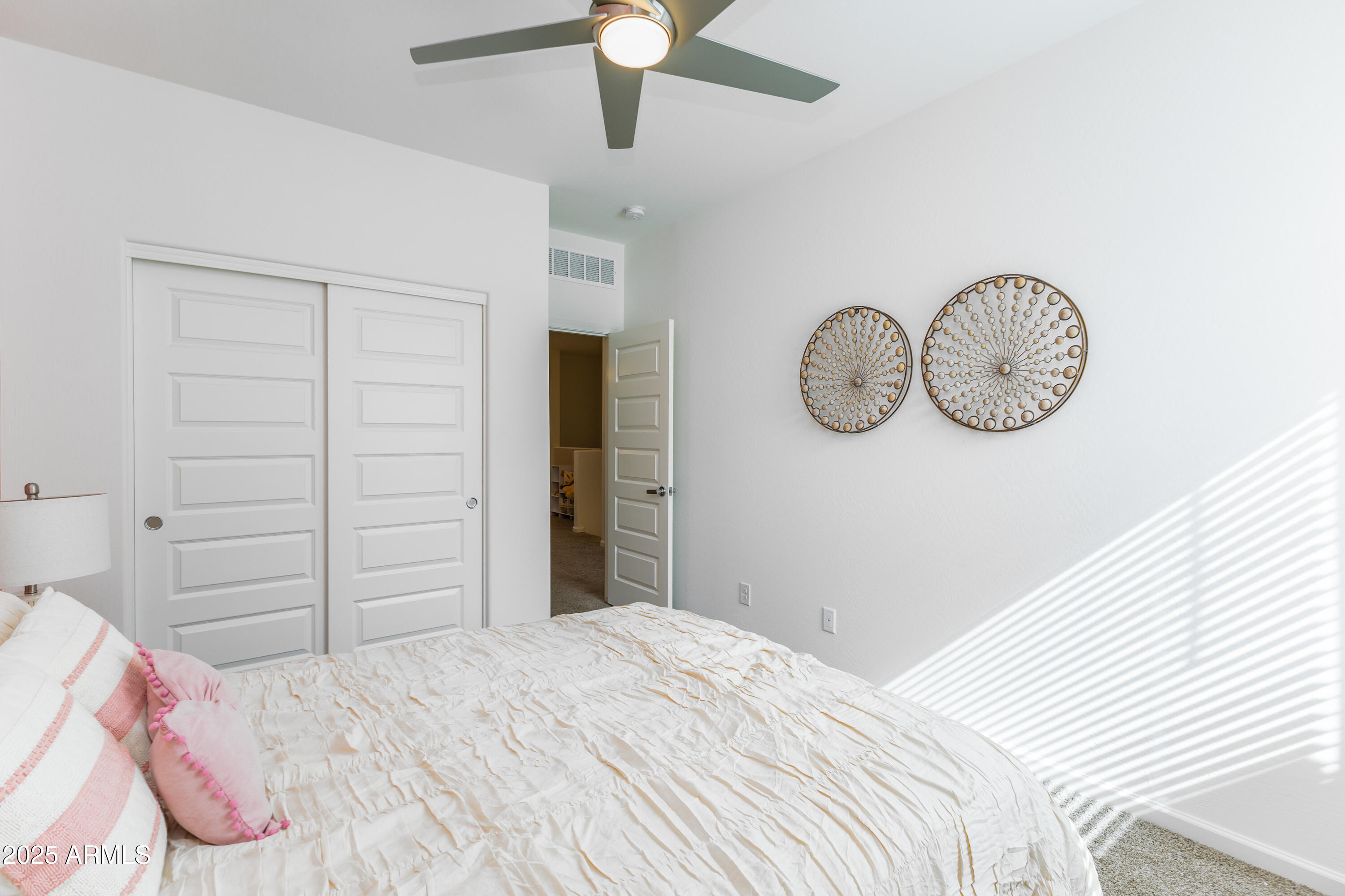 651 North Ironwood Drive, Unit 3 Apache Junction, AZ 85120 - Photo 40 of 48 a bedroom with a bed and ceiling fan