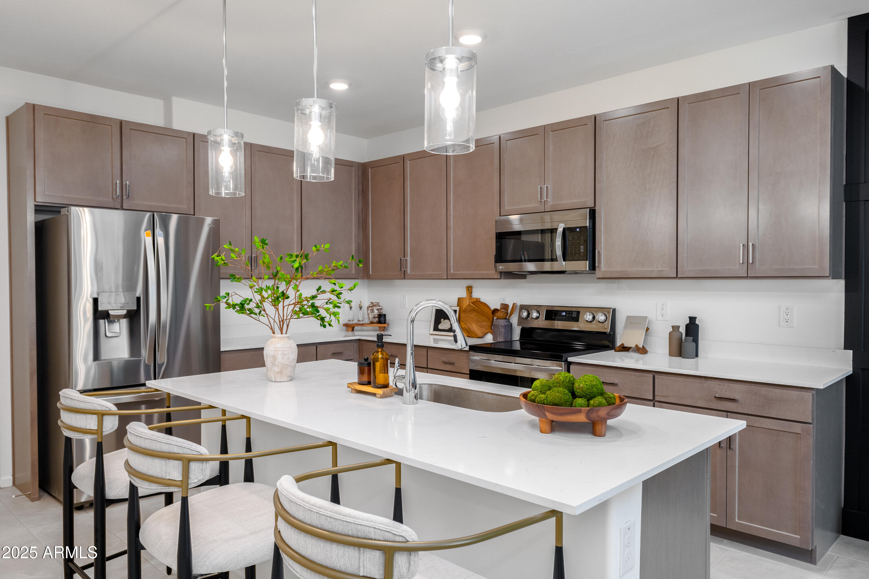 651 North Ironwood Drive, Unit 3 Apache Junction, AZ 85120 - Photo 4 of 48 a kitchen with a sink a refrigerator and chairs