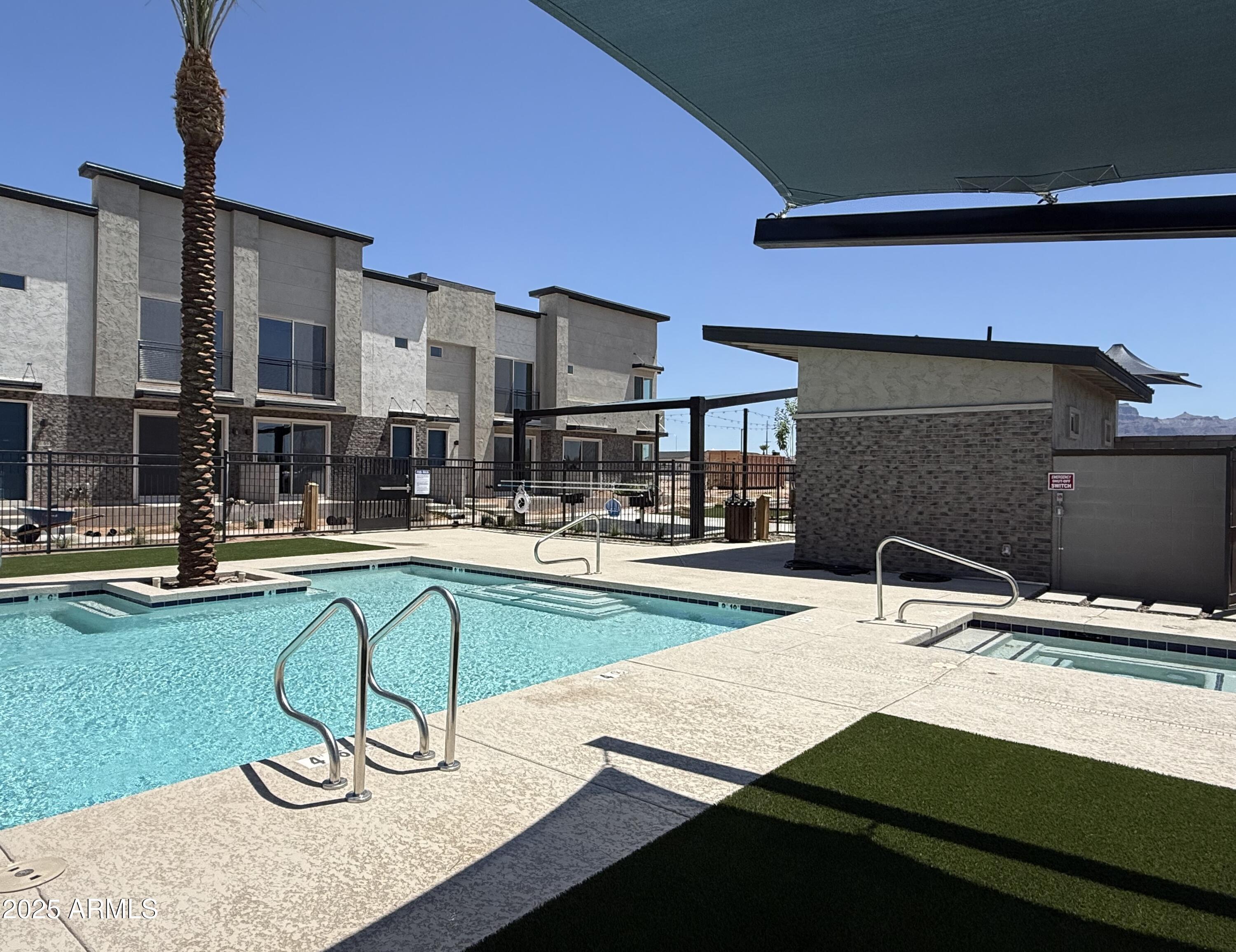 651 North Ironwood Drive, Unit 3 Apache Junction, AZ 85120 - Photo 44 of 48 a swimming pool with outdoor seating and yard