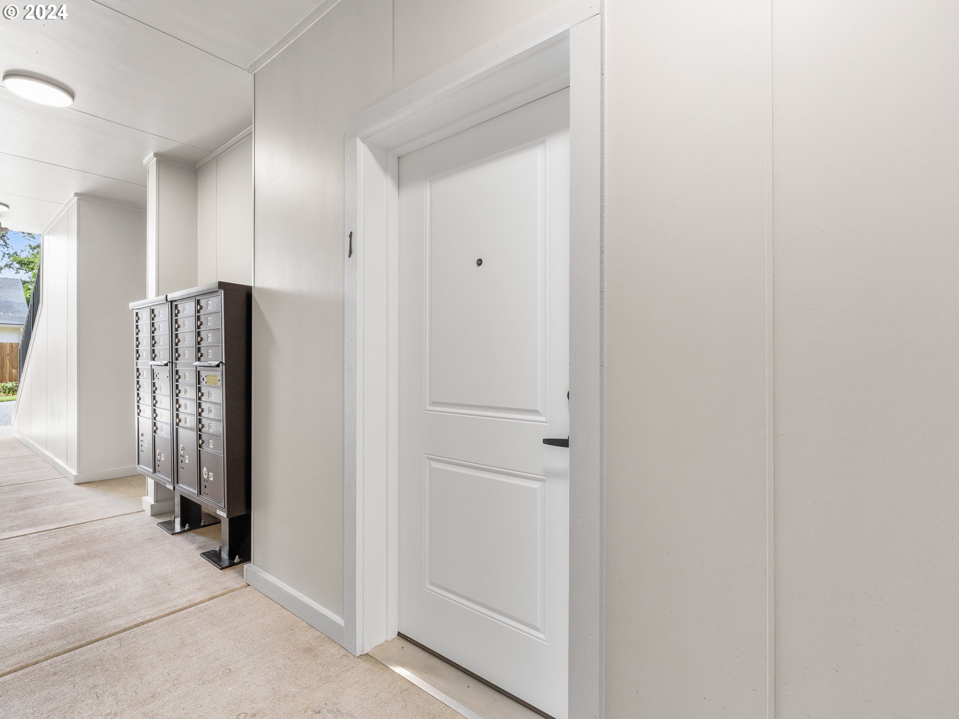 10985 East Burnside Street, Unit 1 Portland, OR 97216 - Photo 3 of 7 a view of a hallway with entryway door