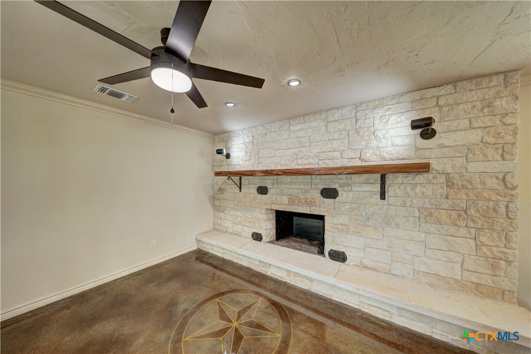 210 Center Point Drive Center Point, TX 78010 - Photo 32 of 44 Living room w fireplace 2 & star etched in stained flooring