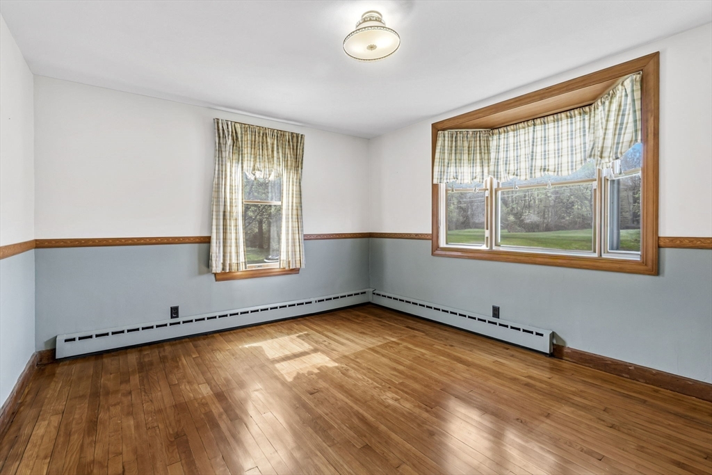 17 Moose Brook Road Southampton, MA 01073 - Photo 12 of 38 an empty room with wooden floor and windows