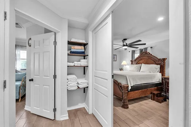 a bedroom with a bed and a window