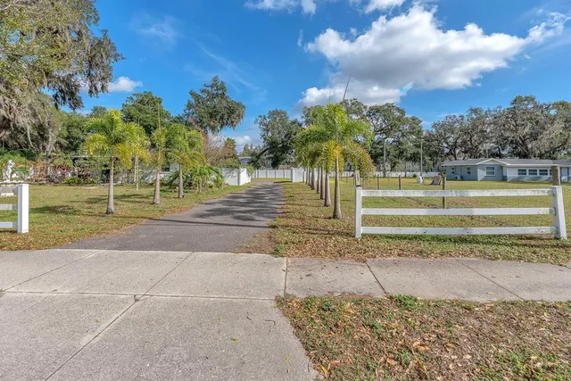 a view of a yard with a trampoline