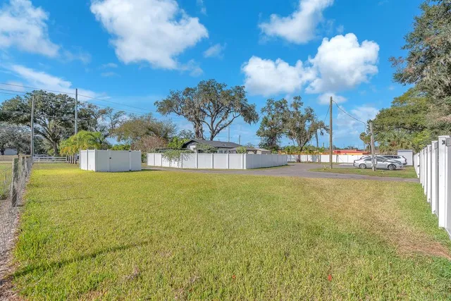 a view of a swimming pool and an outdoor space