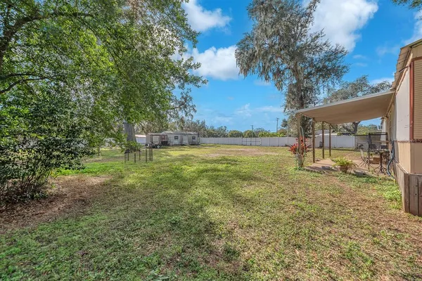a view of a yard with an outdoor space
