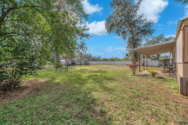 a view of a yard with an outdoor space