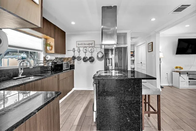a kitchen with counter top space cabinets and stainless steel appliances