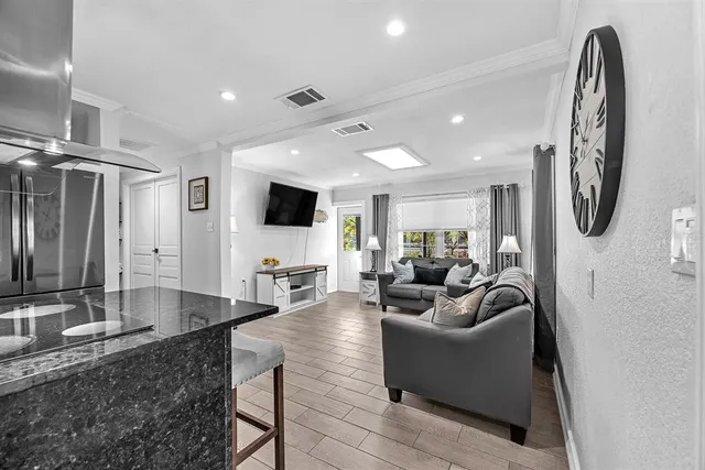 a living room with fireplace furniture and a flat screen tv
