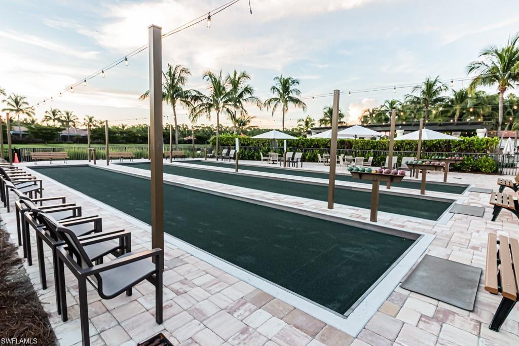 9735 Acqua Court, Unit 611 Naples, FL 34113 - Photo 28 of 30 View of property's community with a bocce ball area and a patio