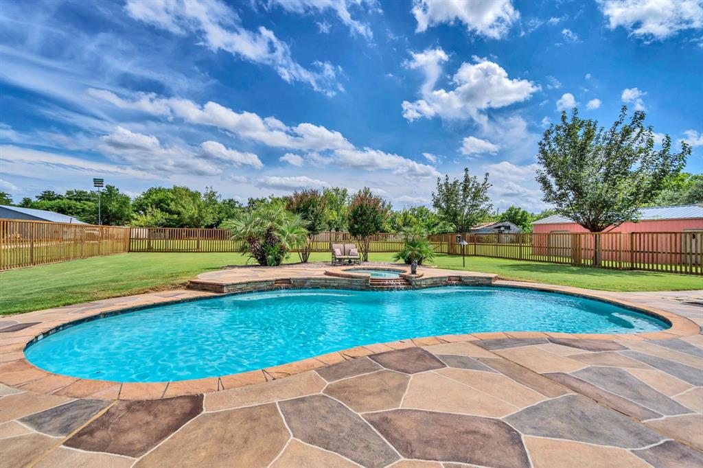50 Buckingham Lane Allen, TX 75002 - Photo 37 of 39 View of swimming pool with a patio area, a fenced backyard, and a pool with connected hot tub