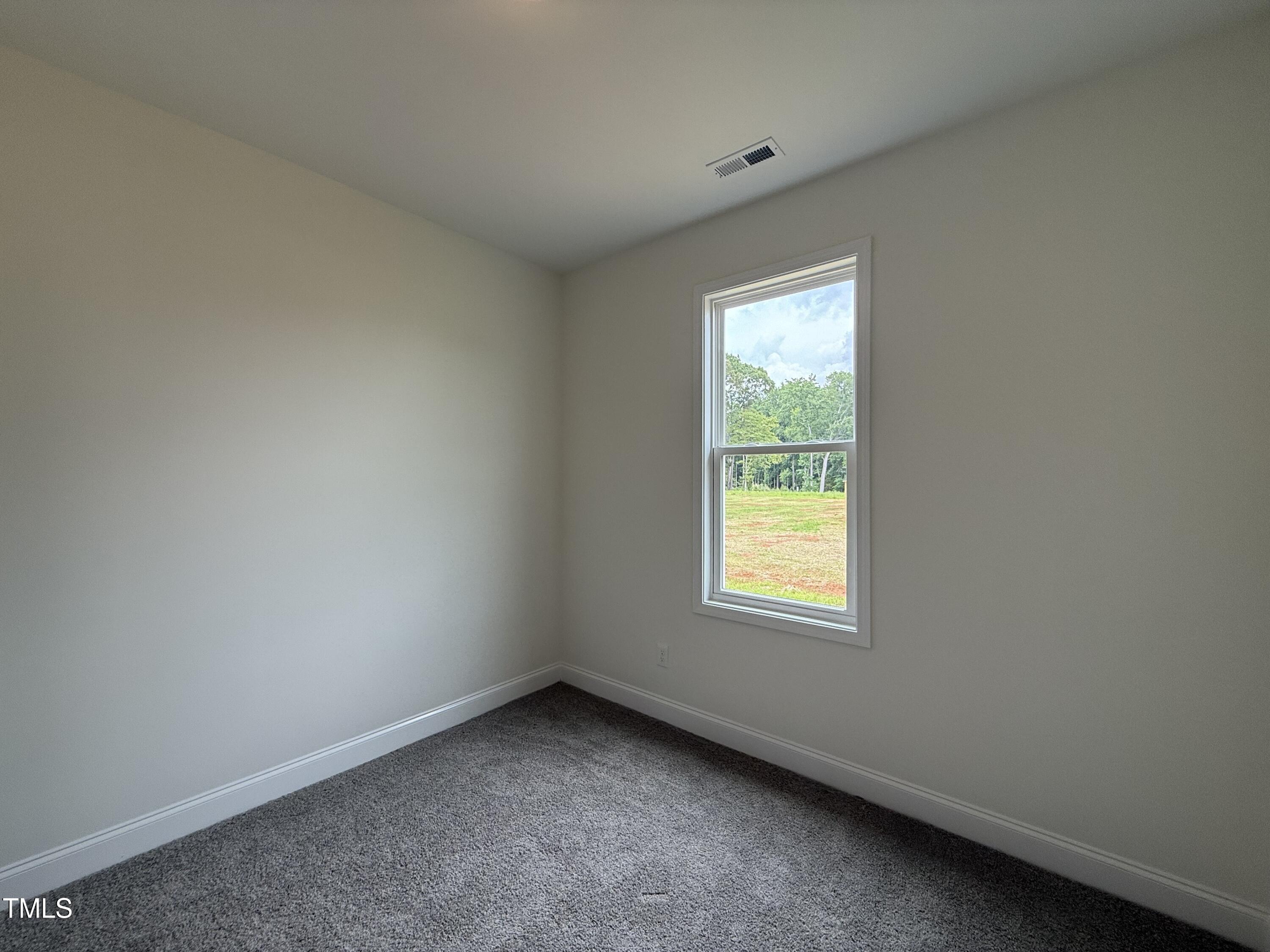 274 Longbow Drive Middlesex, NC 27557 - Photo 11 of 14 an empty room with a window
