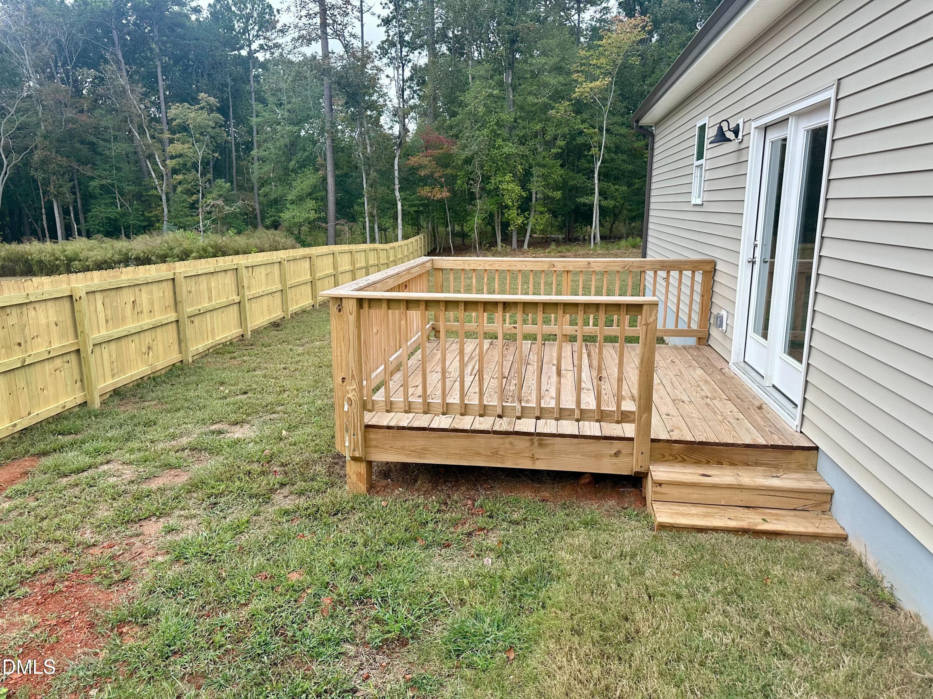 274 Longbow Drive Middlesex, NC 27557 - Photo 3 of 14 a view of backyard with swimming pool and deck