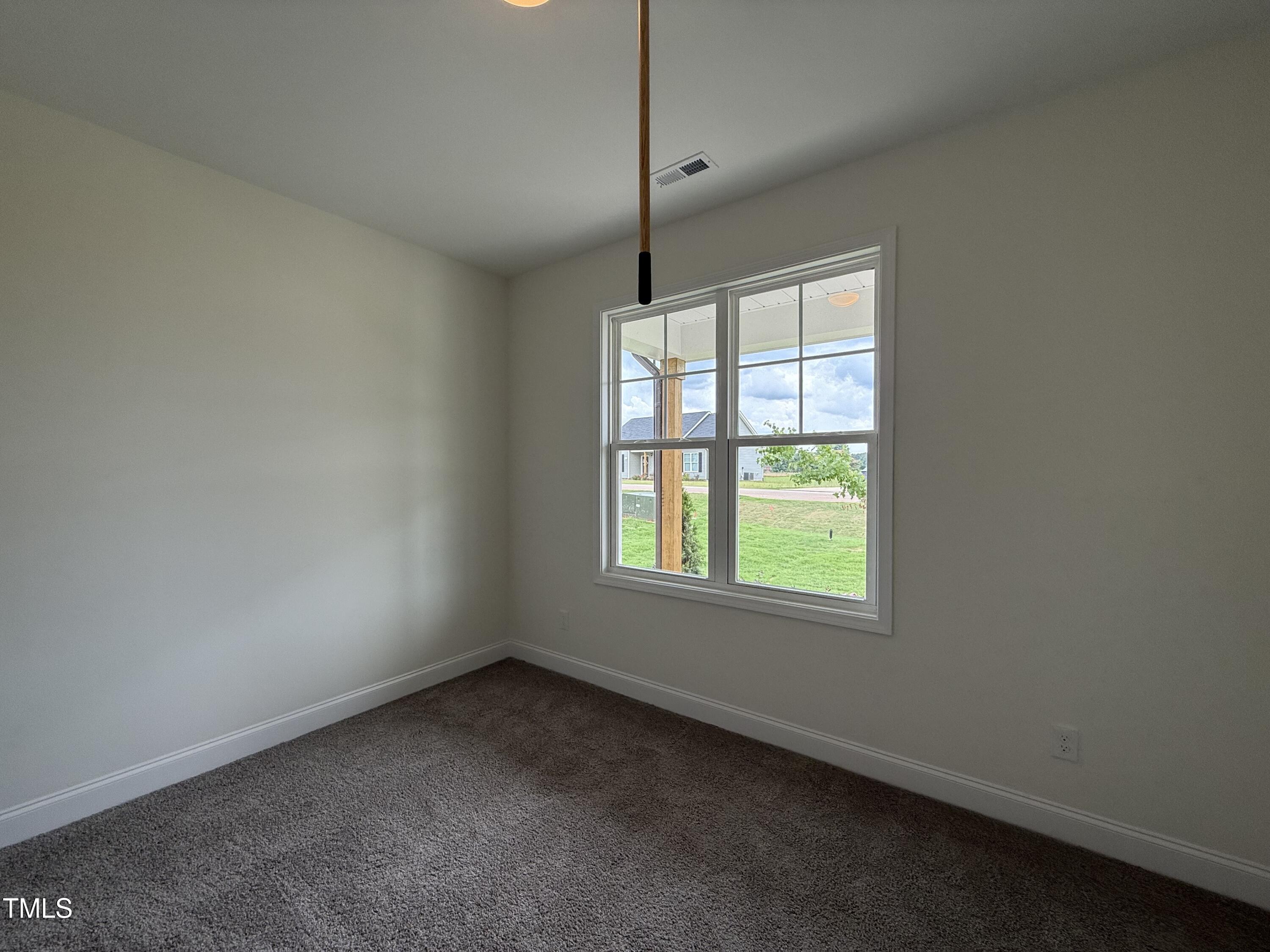 274 Longbow Drive Middlesex, NC 27557 - Photo 10 of 14 a view of an empty room with a window