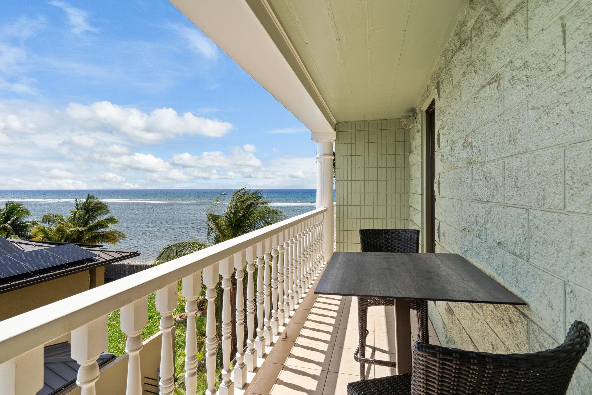a view of balcony with wooden floor
