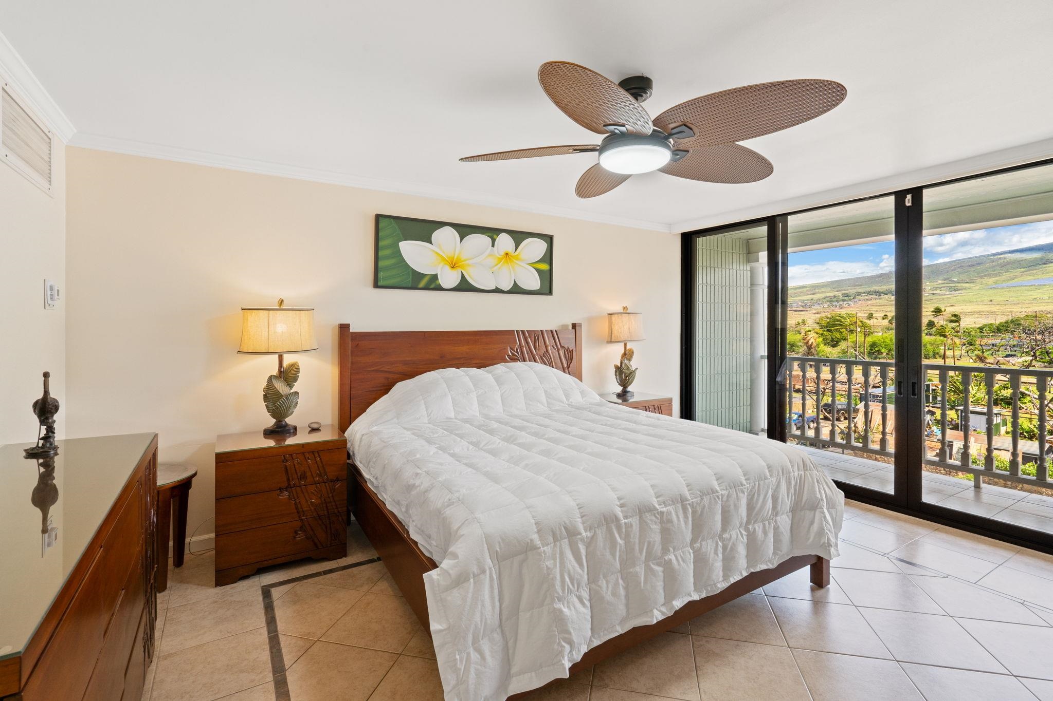 475 Front Street, Unit 402 Lahaina, HI 96761 - Photo 21 of 34 a bedroom with a bed and window