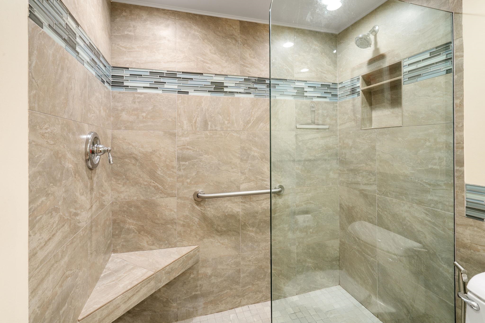 475 Front Street, Unit 402 Lahaina, HI 96761 - Photo 24 of 34 a bathroom with a glass shower door