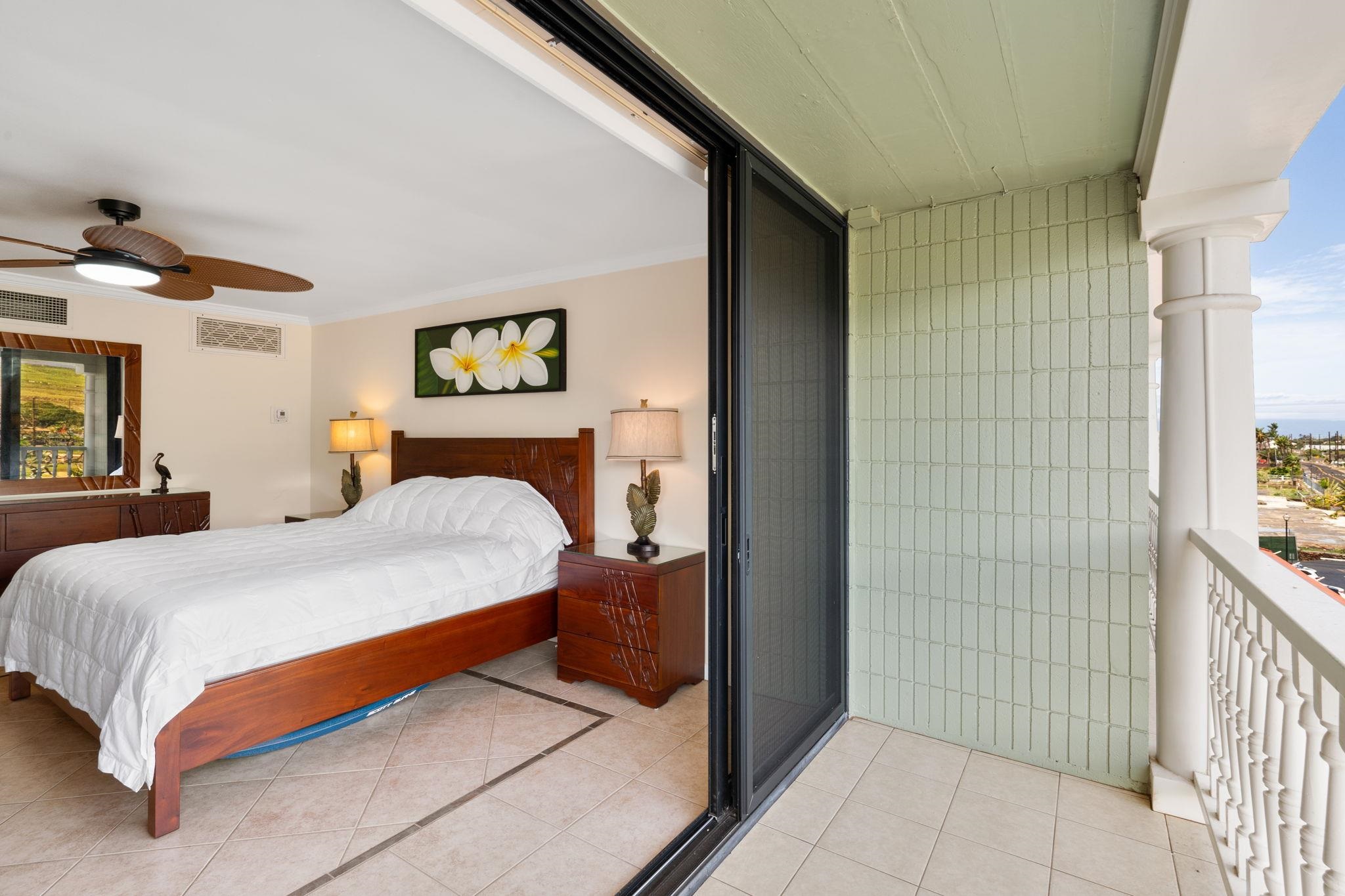 475 Front Street, Unit 402 Lahaina, HI 96761 - Photo 8 of 34 a bedroom with a bed and a painting on the wall