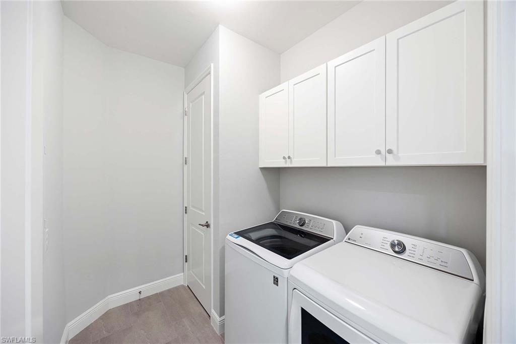 2603 Seychelles Circle, Unit 1505 Naples, FL 34112 - Photo 21 of 35 a utility room with dryer and washer