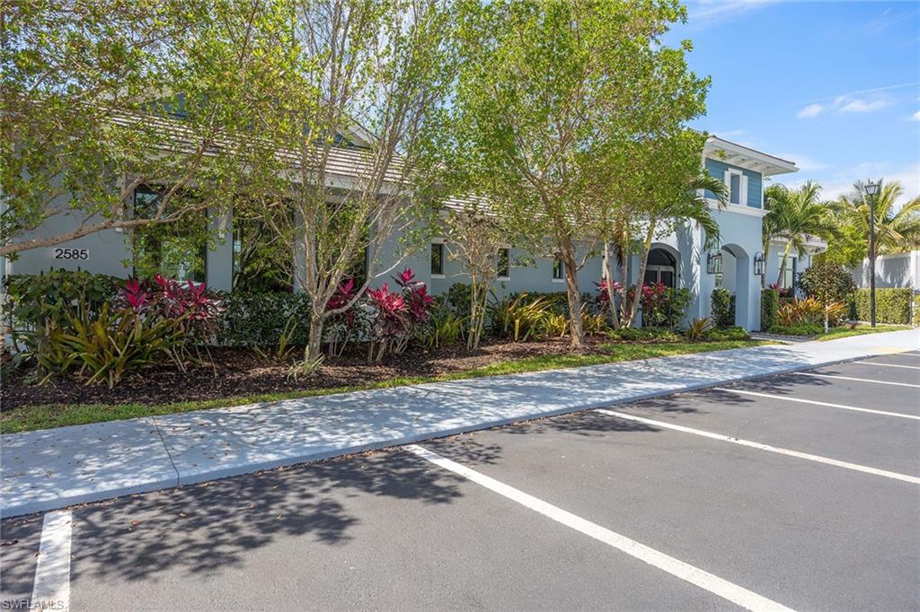 2603 Seychelles Circle, Unit 1505 Naples, FL 34112 - Photo 25 of 35 a view of street along with trees