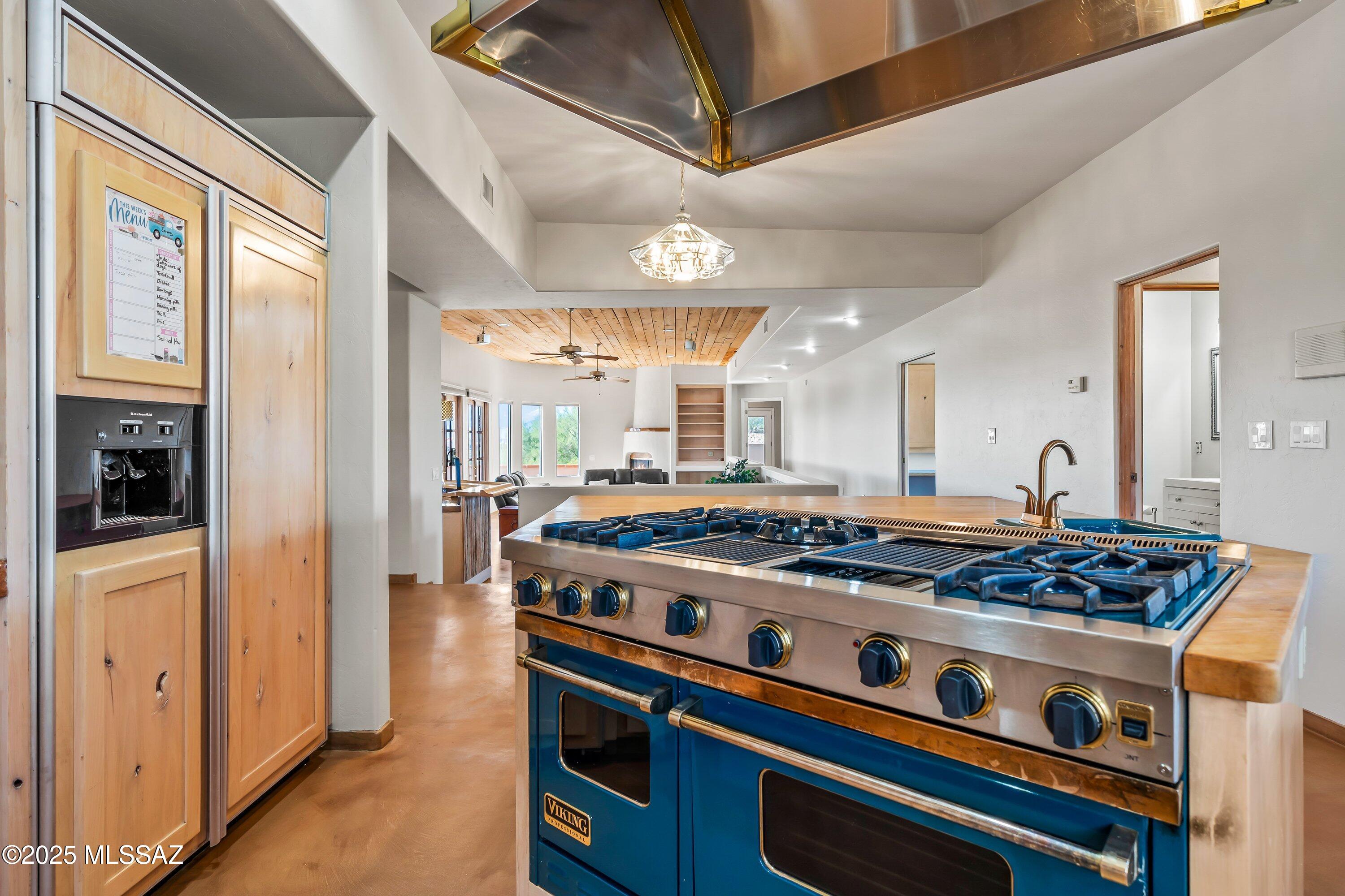 30 West Stone Loop Tucson, AZ 85704 - Photo 17 of 26 a kitchen with stainless steel appliances granite countertop a stove and a refrigerator