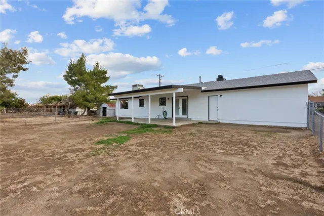 a house view with swimming pool