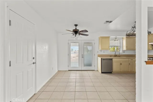 a view of a kitchen with a sink and cabinet