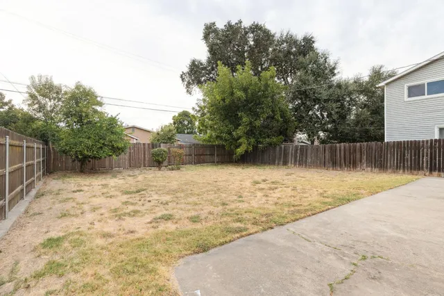 a backyard of a house with lots of green space