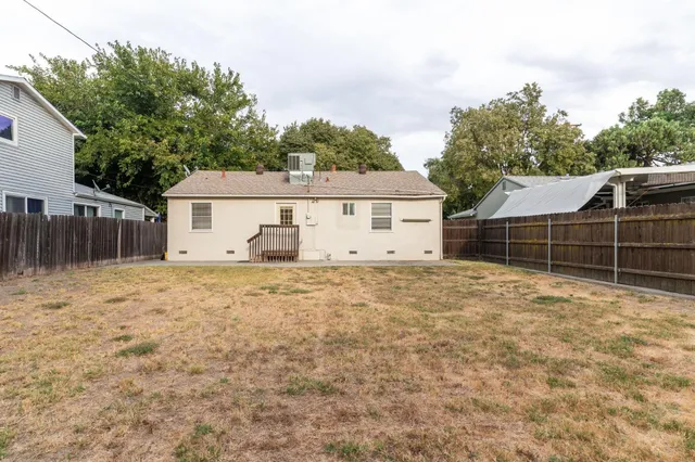 a house view with a backyard space