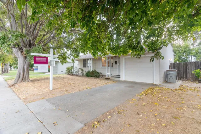 a house with trees in front of it