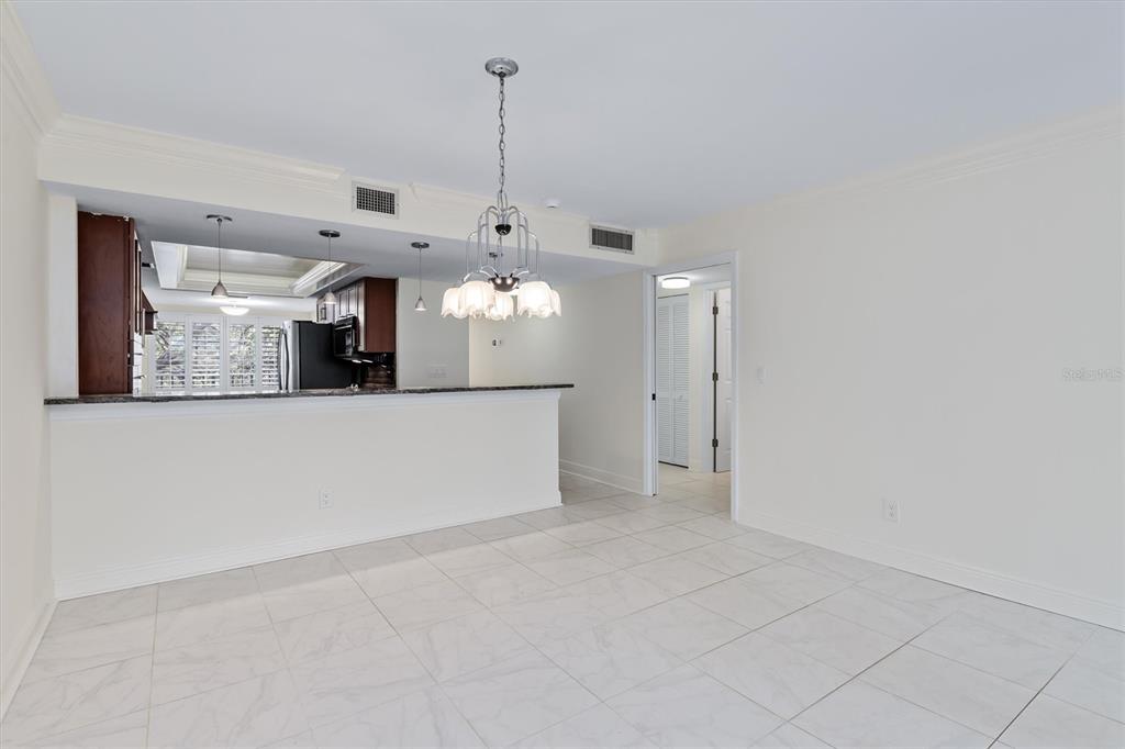 5911 Midnight Pass Road, Unit 206 Sarasota, FL 34242 - Photo 25 of 88 a view of a kitchen with a window