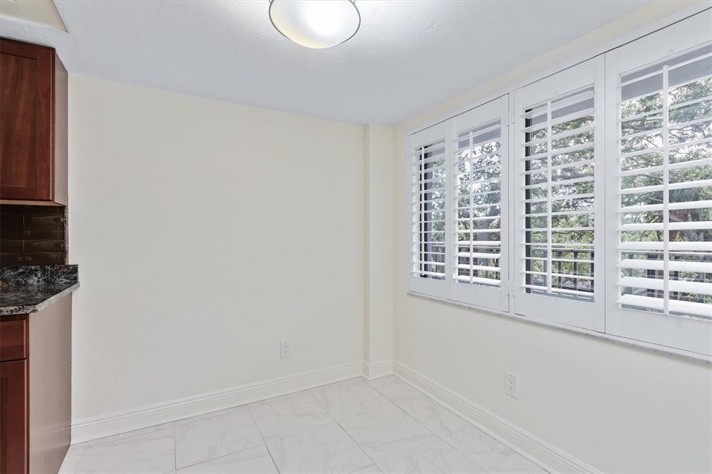 5911 Midnight Pass Road, Unit 206 Sarasota, FL 34242 - Photo 29 of 88 a view of an empty room with a window