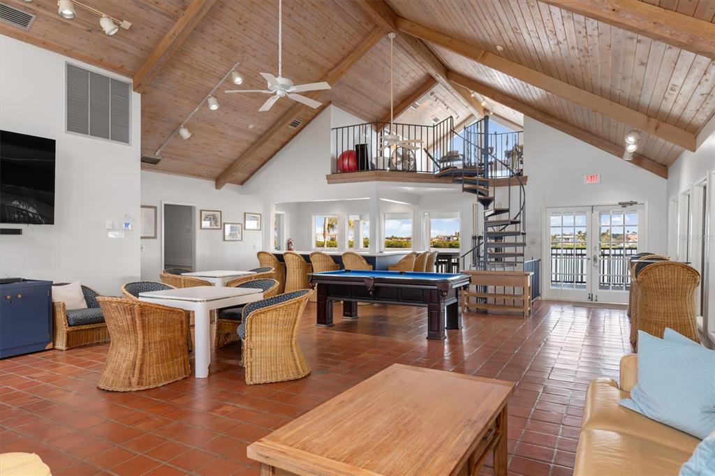 5911 Midnight Pass Road, Unit 206 Sarasota, FL 34242 - Photo 62 of 88 a living room with furniture a table and kitchen view