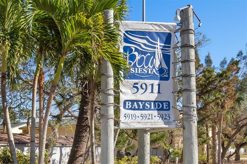 5911 Midnight Pass Road, Unit 206 Sarasota, FL 34242 - Photo 71 of 88 a sign on a pole