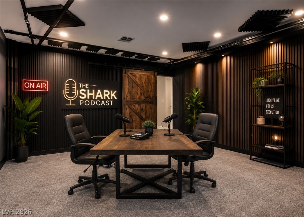 264 Pointe Ranier Avenue Henderson, NV 89012 - Photo 20 of 37 Textured wood-paneled walls and clean recessed lighting define this modern professional studio space.Virtually Staged