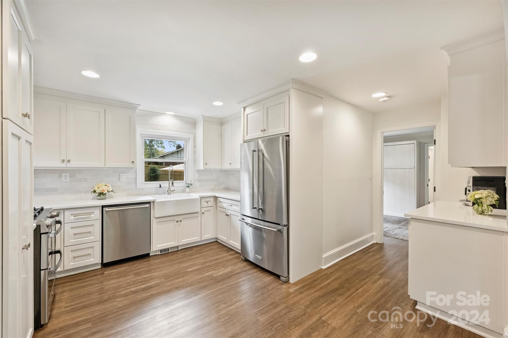 5501 Seacroft Road Charlotte, NC 28210 - Photo 14 of 37 a kitchen with a refrigerator sink and cabinets
