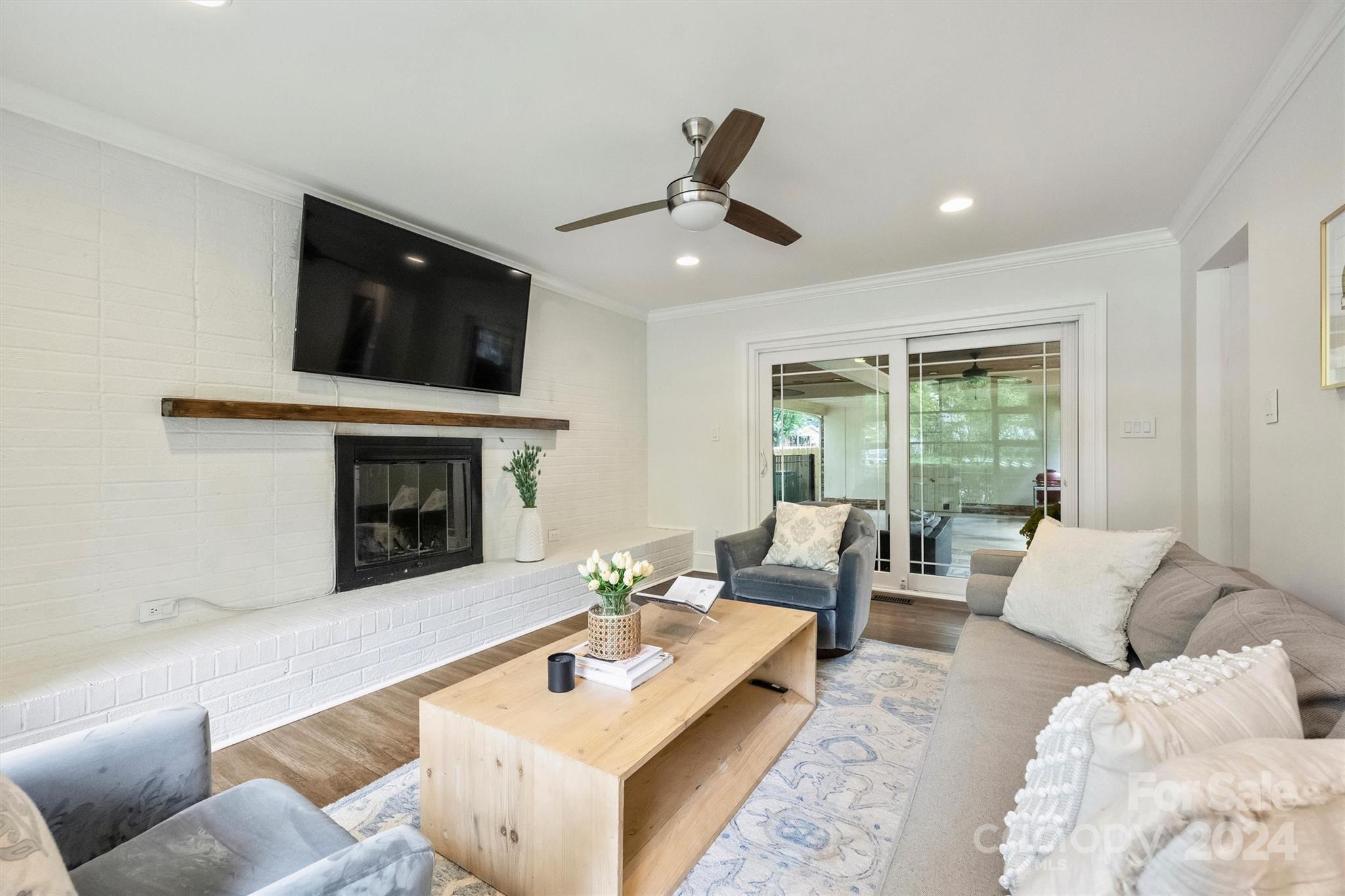 5501 Seacroft Road Charlotte, NC 28210 - Photo 17 of 37 a living room with furniture and a fireplace