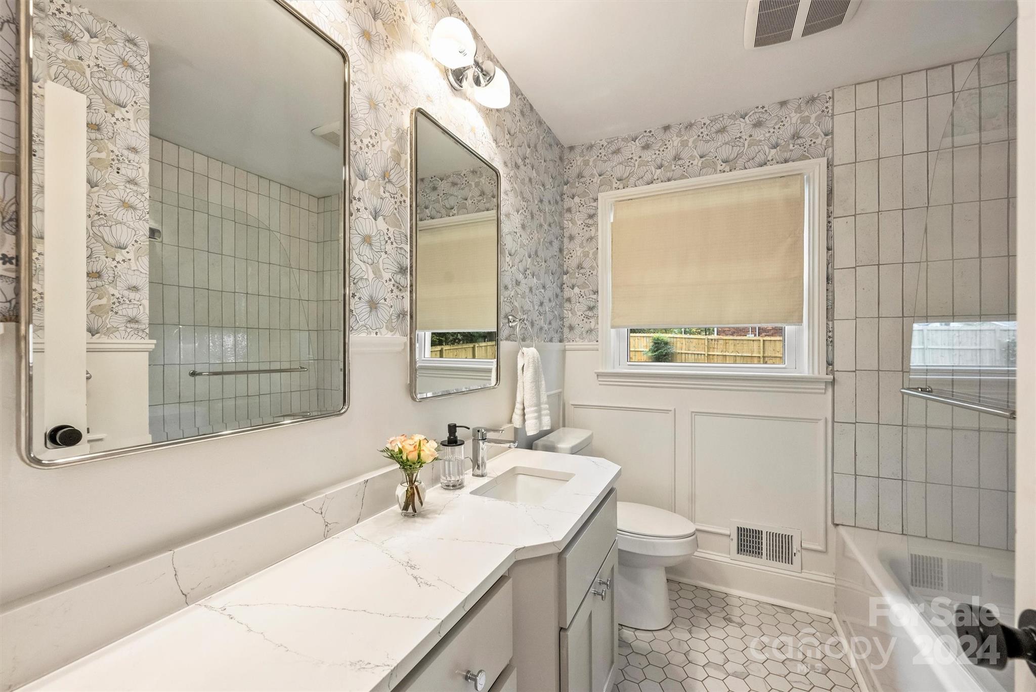 5501 Seacroft Road Charlotte, NC 28210 - Photo 27 of 37 a bathroom with a sink toilet and shower