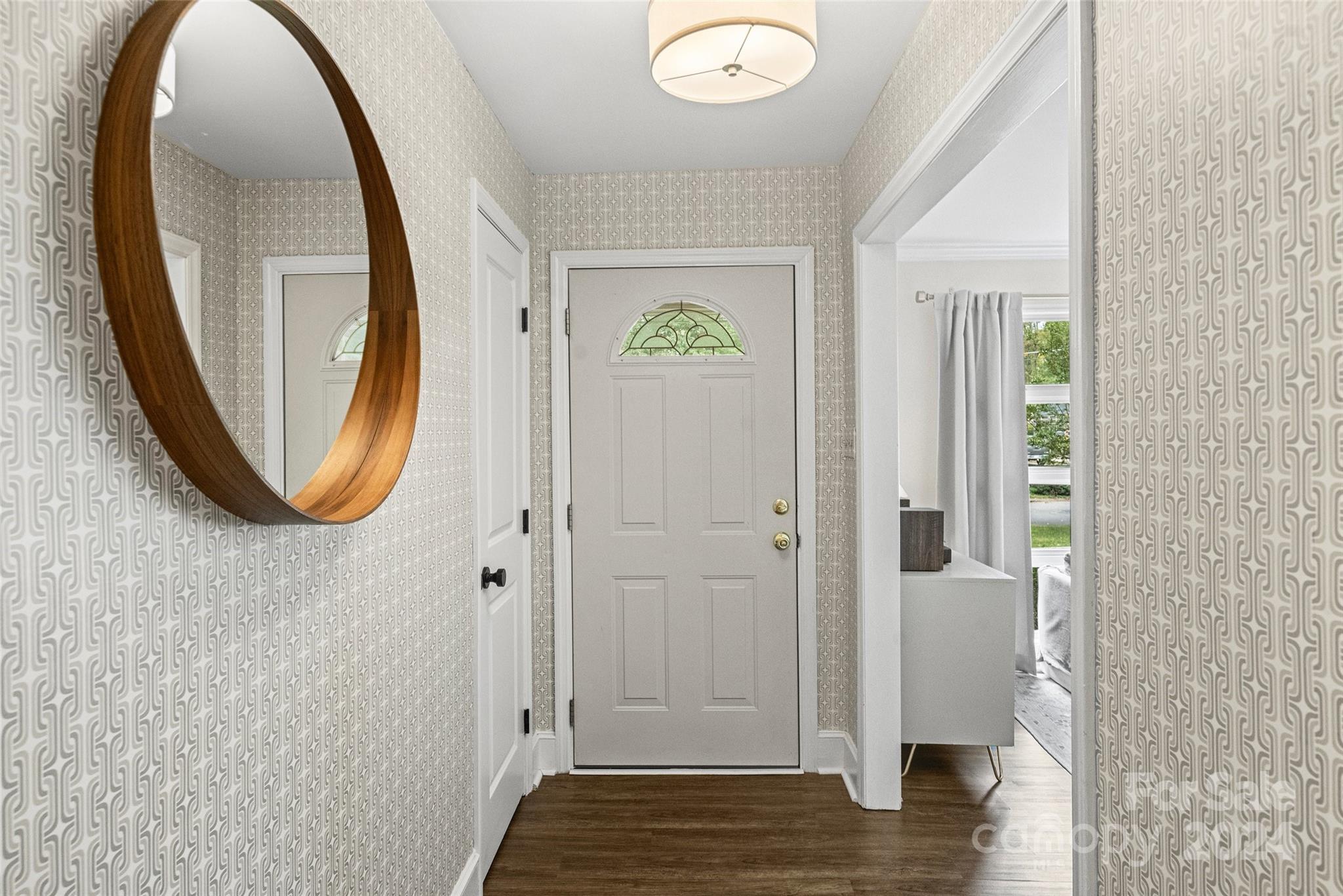 5501 Seacroft Road Charlotte, NC 28210 - Photo 4 of 37 a view of a hallway with wooden floor and entryway