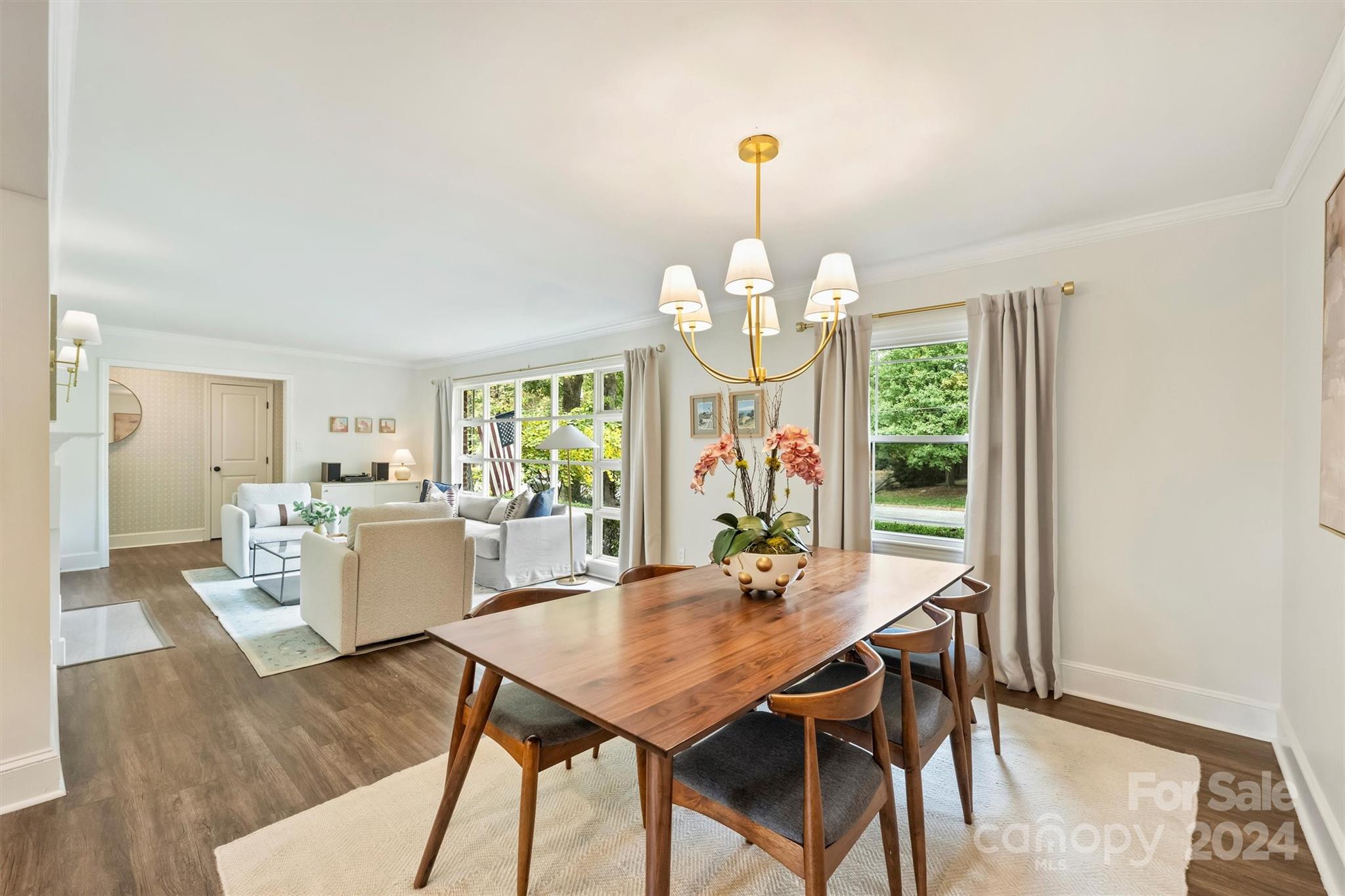 5501 Seacroft Road Charlotte, NC 28210 - Photo 9 of 37 a view of a dining room with furniture a livingroom and chandelier