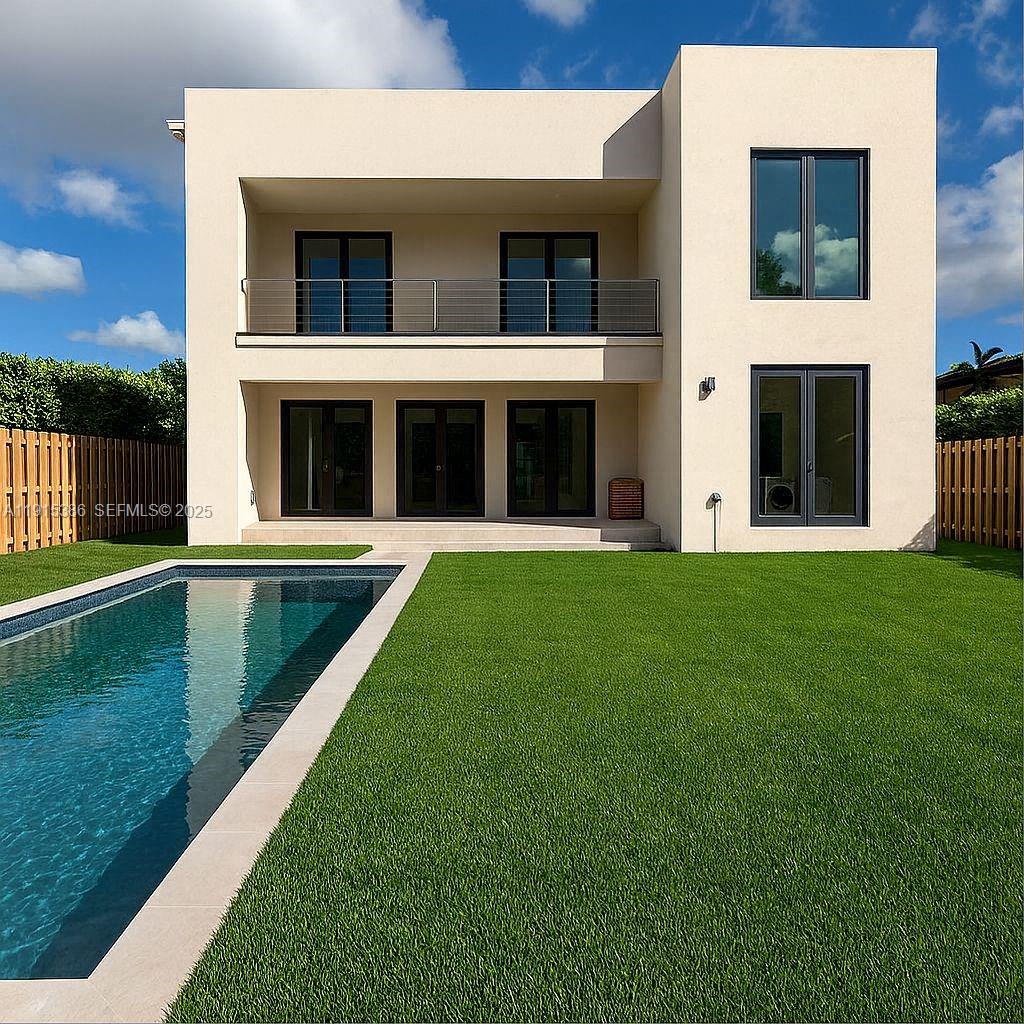 1366 Southwest 15th Street Miami, FL 33145 - Photo 2 of 5 a view of an house with backyard space and balcony