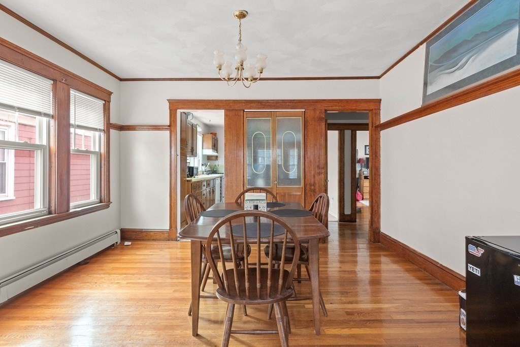 51 Sargent Avenue, Unit 2 Somerville, MA 02145 - Photo 3 of 10 a view of a dining room with furniture window and wooden floor
