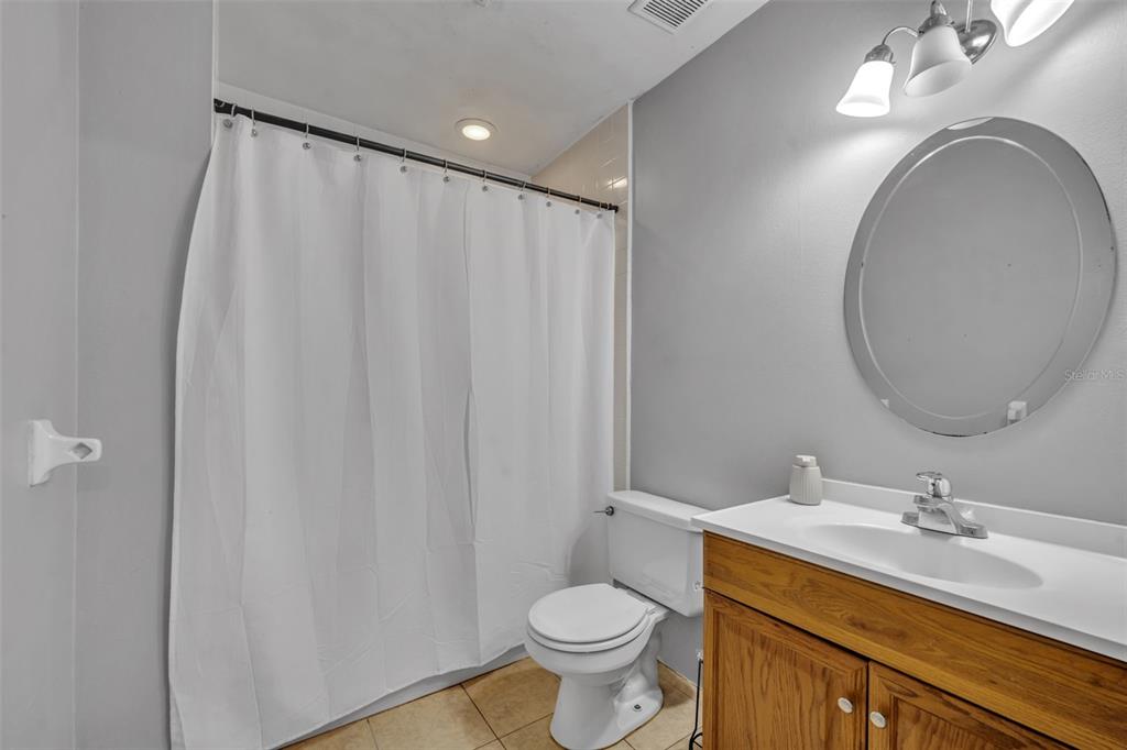 222 West Panama Road Winter Springs, FL 32708 - Photo 18 of 25 a bathroom with a granite countertop sink toilet and a mirror